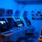 a room with a bunch of arcade machines in it retro gaming setup, japanese game interface