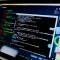 laptop compute displaying command prompt cisco router, password login screen, network admin
