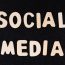 How can social media tools help in optimizing social media posts for search engines?