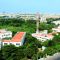 white and red concrete building near green trees during daytime campus, university, artificial intelligence, innovation
