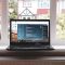 black laptop computer turned on virtual desktops, windows interface, multitasking tools