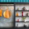 two hanging brown wooden boards  glass food containers, safe food storage, modern kitchen
