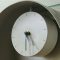 A clock on a wall with a glass top office desk clock punctual workers