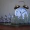 a clock sitting on top of a table next to chess pieces office desk clock punctual workers