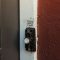 a close up of a door handle on a door kwikset lock, smartcode keypad, front door