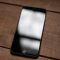 silver iphone 6 on brown wooden table iphone vpn settings, online privacy, mobile data protection