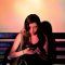 woman wearing black tank dress using smartphone person scrolling smartphone,tiktok app,short attention span