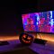 black flat screen tv turned on near black remote control family tv setup, remote programming, fun night