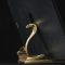 a golden snake statue sitting on top of a table linux terminal python version check