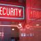 a red security sign and a blue security sign cybersecurity, password hacking, data breach
