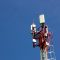 A cell phone tower with a blue sky in the background wifi internet signal mobile speed test