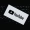 Youtube logo on a dark keyboard youtube id verification, digital regulation, privacy policy