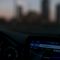 Gps navigation screen in a car at dusk smart city map visualization, traffic data overlay, urban planning dashboard, infrastructure layers