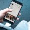 person holding Android smartphone digital community engagement, mobile interaction, social platform dashboard
